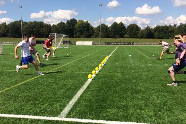 kids playing dodgeball and tag archery in a london park